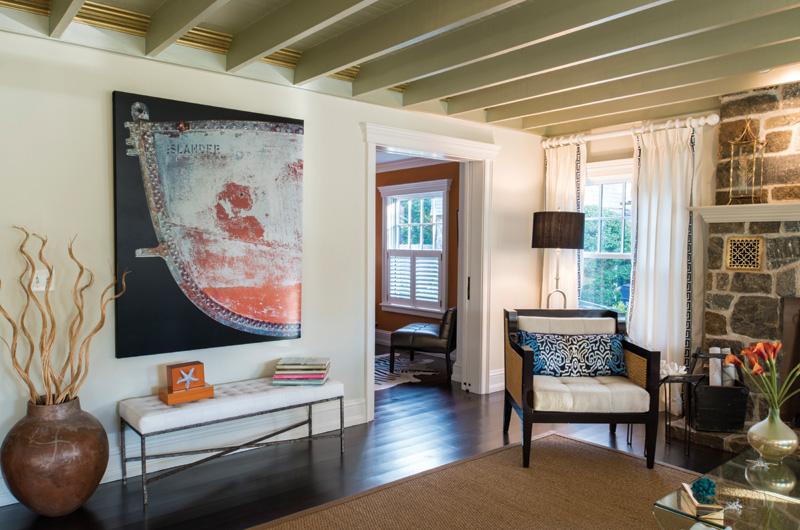“Our builders were aghast,” Healey said of her decision to incorporate gold elements into the beamed first-floor ceiling.