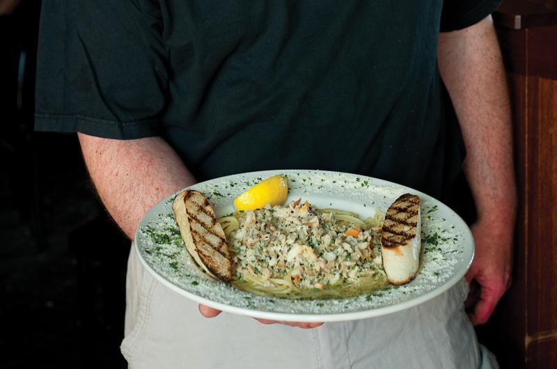 Glen Caldwell serves up linguine and clams.