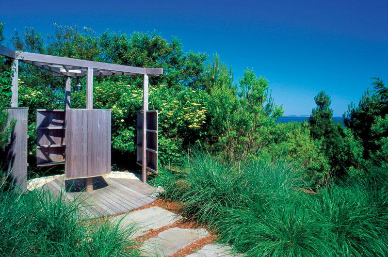This outdoor shower in Aquinnah was designed by Hutker Architects to give the user privacy and suit the surrounding natural environment,
from both the outside (above) and inside (facing). The open walls and sunny location are also perfect for ventilation and drying.