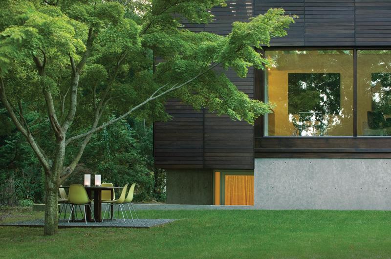 In a neighborhood of cedar shingles and clapboards, this mahogany-sided house draws stares from passersby.