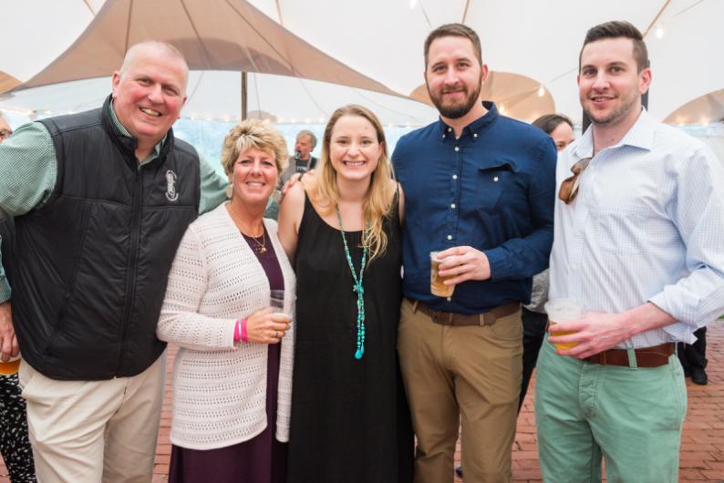 Julia Celeste, center, and Zach Tarka, second from right, won Best New Store fro Rosewater Wine & Spirits.