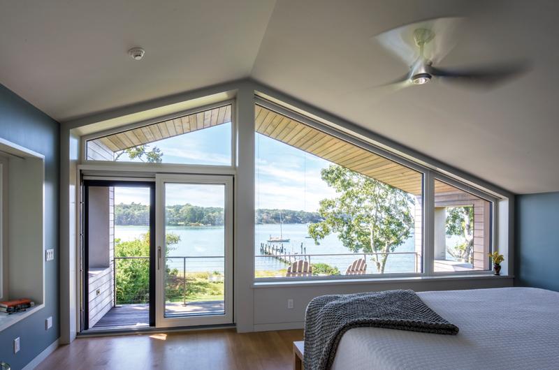 The simple master suite has its own deck over-looking Lake Tashmoo.