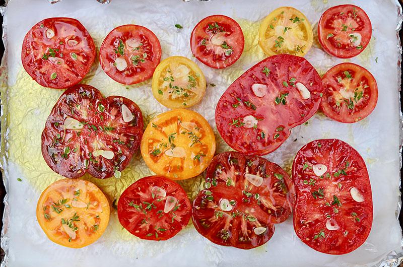 Before roasting, the tomato halves look pretty on the sheet pan.