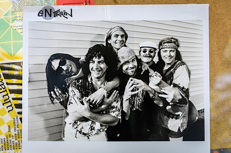 All aboard the original Entrain: Johnny Cruz, Rob Loyot, Tom Major, Judd Fuller, Sam Holmstock, and Bausman in a 1992 promotional photo.