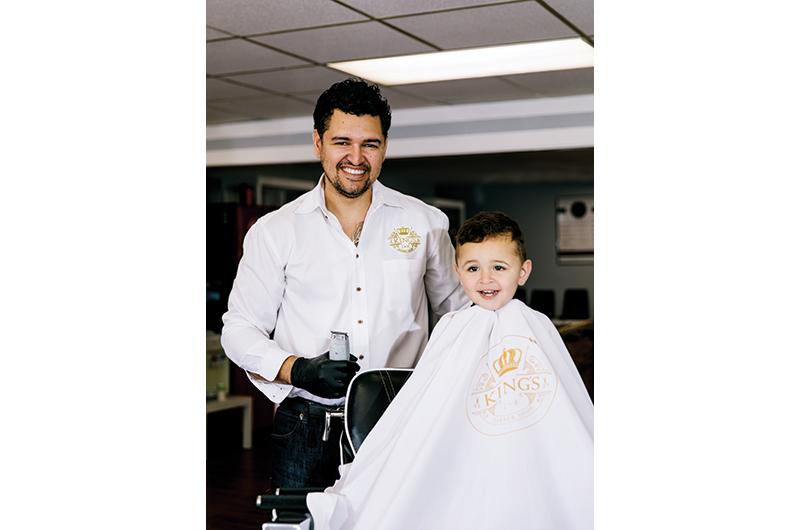 Alexandre Marins gives son Benjamin a Best Hair Salon–worthy trim at King’s Barber Shop.