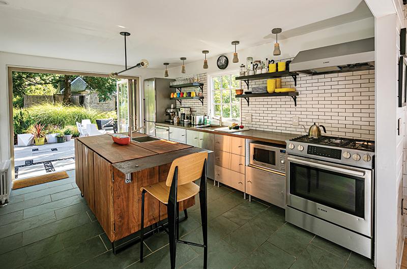 Sliding glass doors allow seamless flow from the kitchen to a granite patio.
