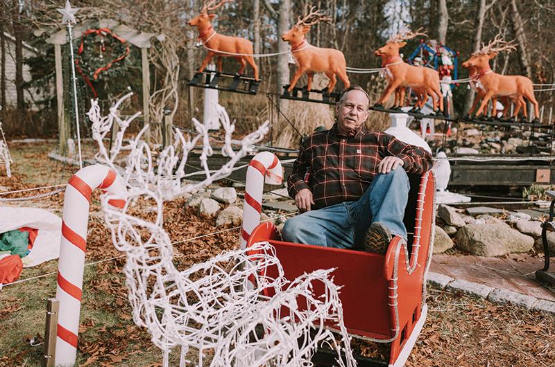 He’s part elf, part woodworker: Robert Gatchell’s first foray into holiday decorating began with this handcrafted sleigh.