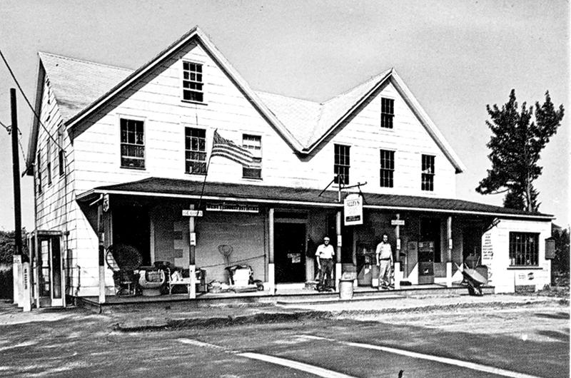 John Alley’s father, Albion “Beanie” Alley, and brother James “Jimmy” Alley in front of the general store in the mid-1960s.