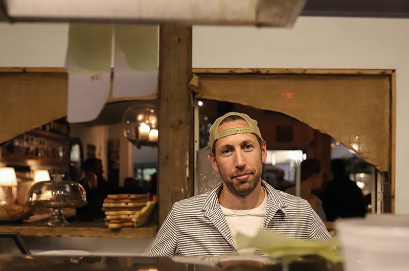 Ted Courtney expedites orders in The Covington kitchen.