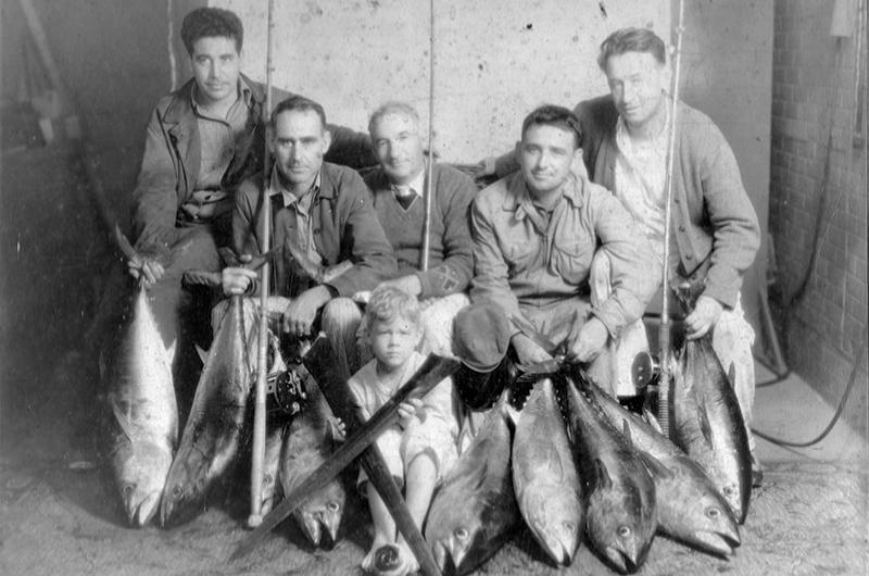 Clayt, second from left, after an offshore fishing trip, circa 1920.