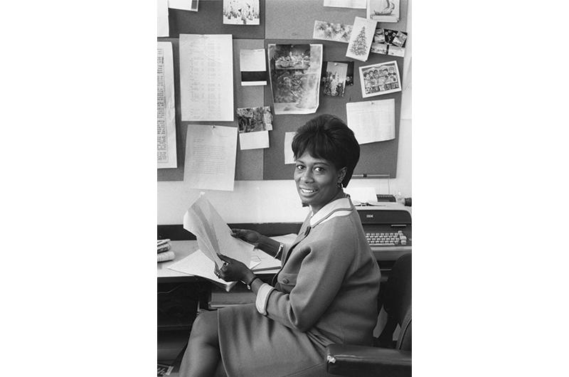 Littles at her desk in the Time-Life Building in the 1970s.