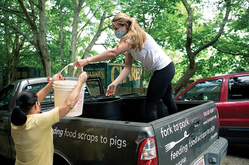 Douglas spends a few hours each day making her rounds to various restaurants to pick up gallons of food scraps to feed to her pigs.