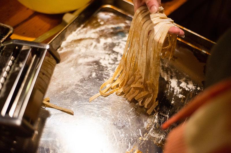 Gently gather the freshly cut pasta.
