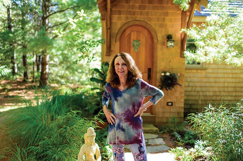 Yans outside her guest cottage.