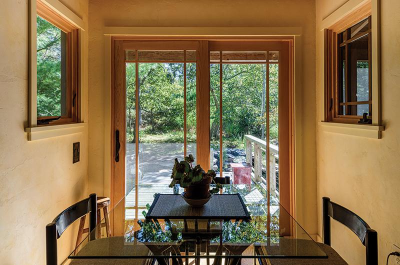The dining room opens up into the backyard, which features a koi pond with waterfalls.