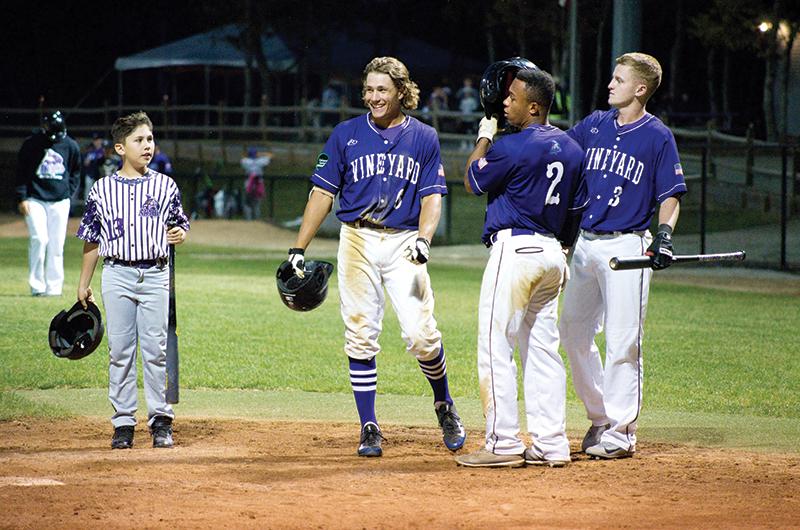 Batboy Bryan Sornas, Chamberlain, Nelson, and Jackson Raper on opening night in 2018.