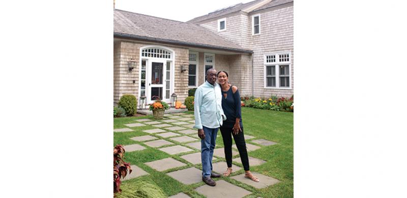 Lloyd and Teri Trotter at the entrance to their home, which they call Sandy Lane.