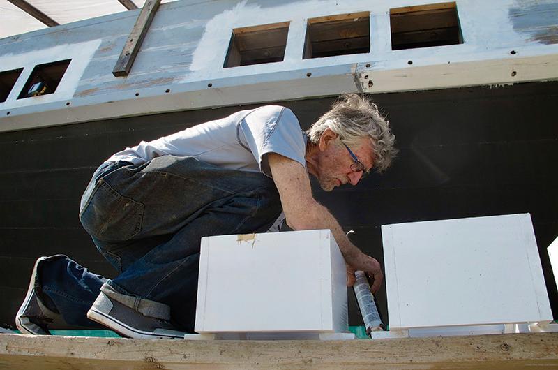Box and a changing cast of volunteers built, sanded, and caulked Seeker.