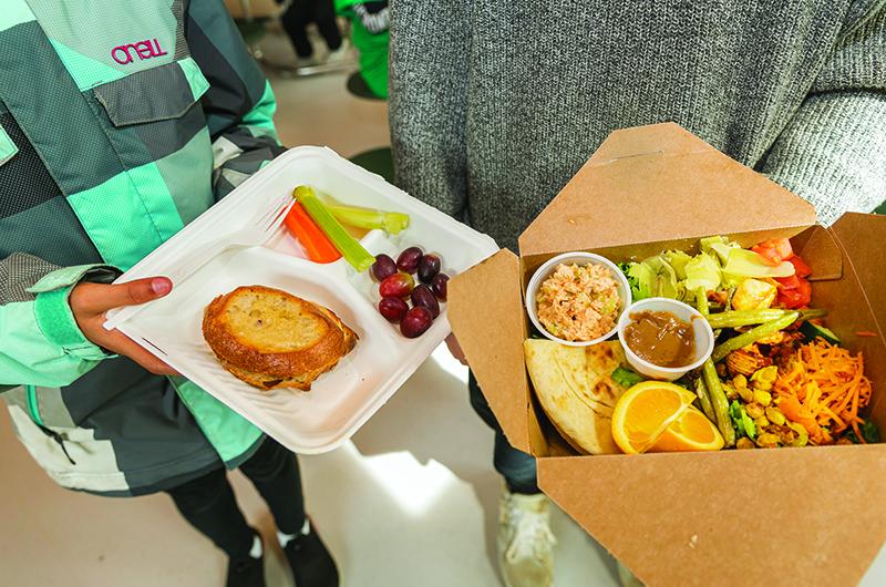 Students can choose between a hot lunch, such as a ham and cheese panini, or a salad bar meal.
