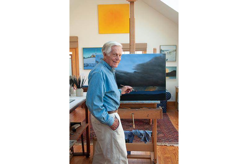 Kib Bramhall, inside his West Tisbury studio, is surrounded
by completed paintings, works in progress, and treasured mementos.