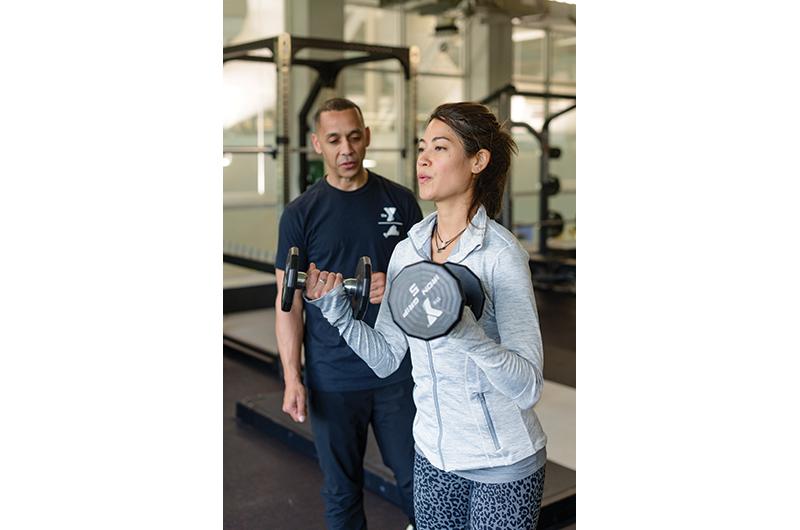 Health and wellness director Asil Cash and client Vanessa Vacharasovan frequently get the lead out at the YMCA.
