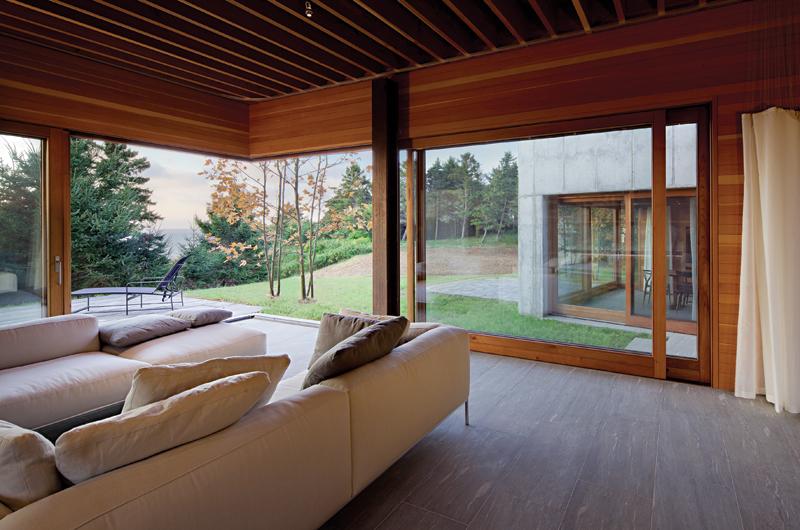 Sliding glass pocket doors built by William Parry of Chilmark allow many rooms to be converted into semi-exterior spaces.